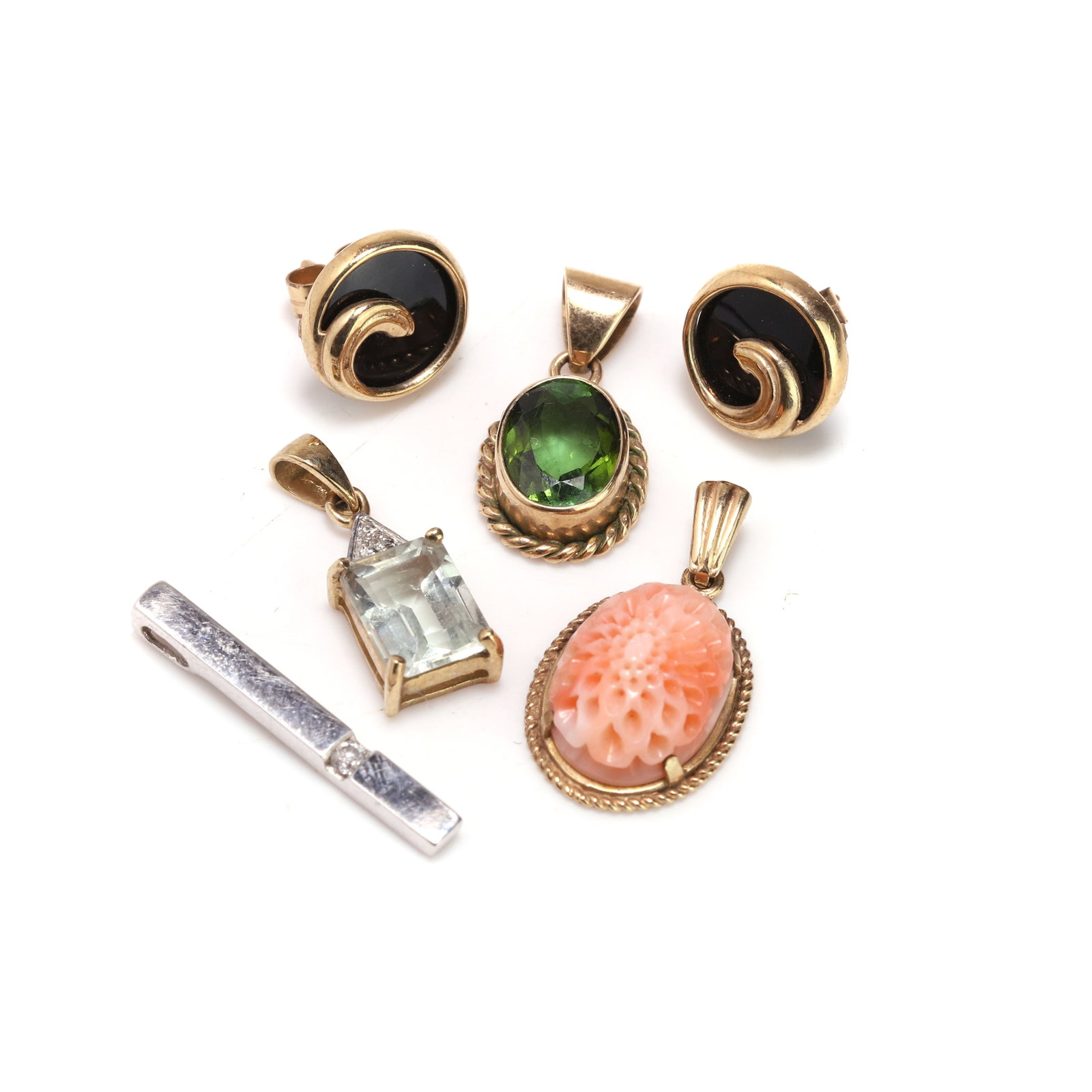 A small group of gemstone set jewellery,: A small group of gemstone set jewellery, to include an oval peridot pendant with rope border, an emerald cut aquamarine pendant, a bar pendant set with round brilliant cut diamond, an oval carved cora