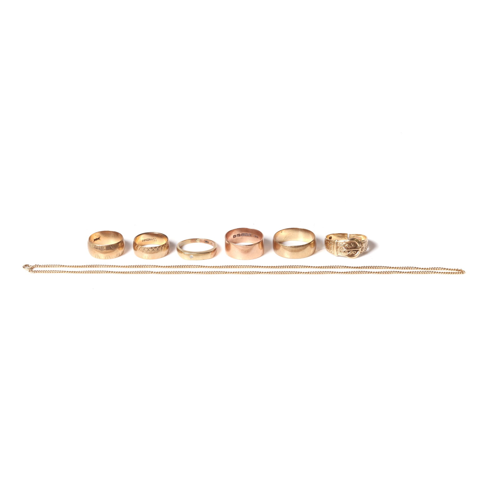 A group of jewellery,: A group of jewellery, comprising four 9ct gold wedding rings, a 9ct gold buckle ring, shank cut through, a diamond set band ring, and a 9ct gold curb link chain, all hallmarked or tested as approximat