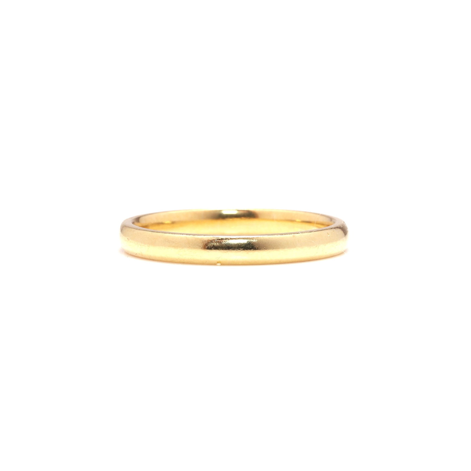 An 18ct gold wedding band,: An 18ct gold wedding band, hallmarked Birmingham 2006 (Ring size TΩ; 4.5g) Condition Report: Surface scratches and marks. Dimensions: Ring size TΩ; 4.5g