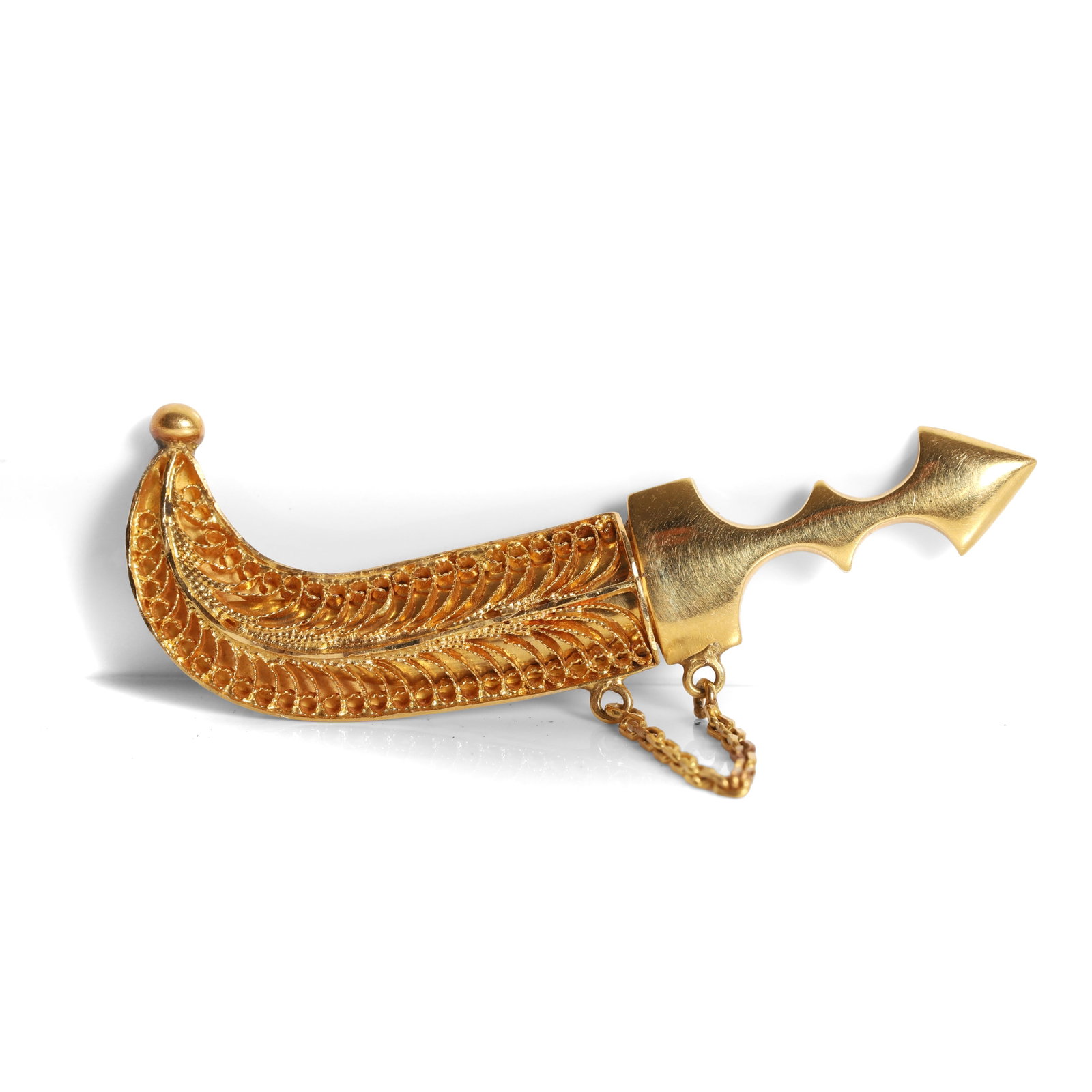 A Middle Eastern gold jambiya brooch, (1 of 2)