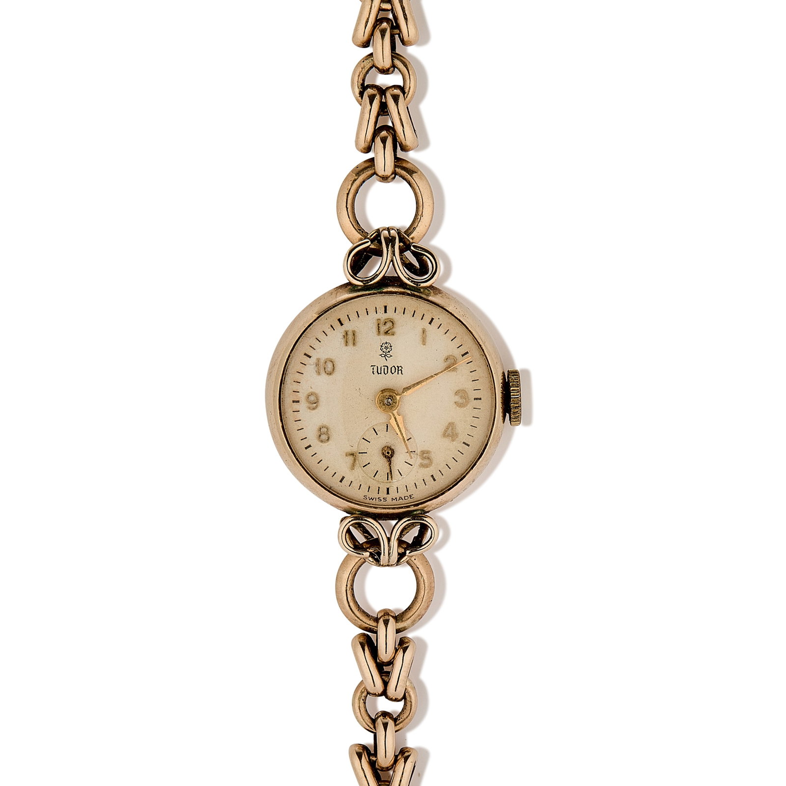 Tudor, a 9ct gold ladies' mechanical bracelet watch,: Tudor, a 9ct gold ladies' mechanical bracelet watch, the champagne dial with raised gilt Arabic numerals and subsidiary seconds dial, snap-off case back marked R.W.Co.Ltd, Chester 1952, 17 rubies manu