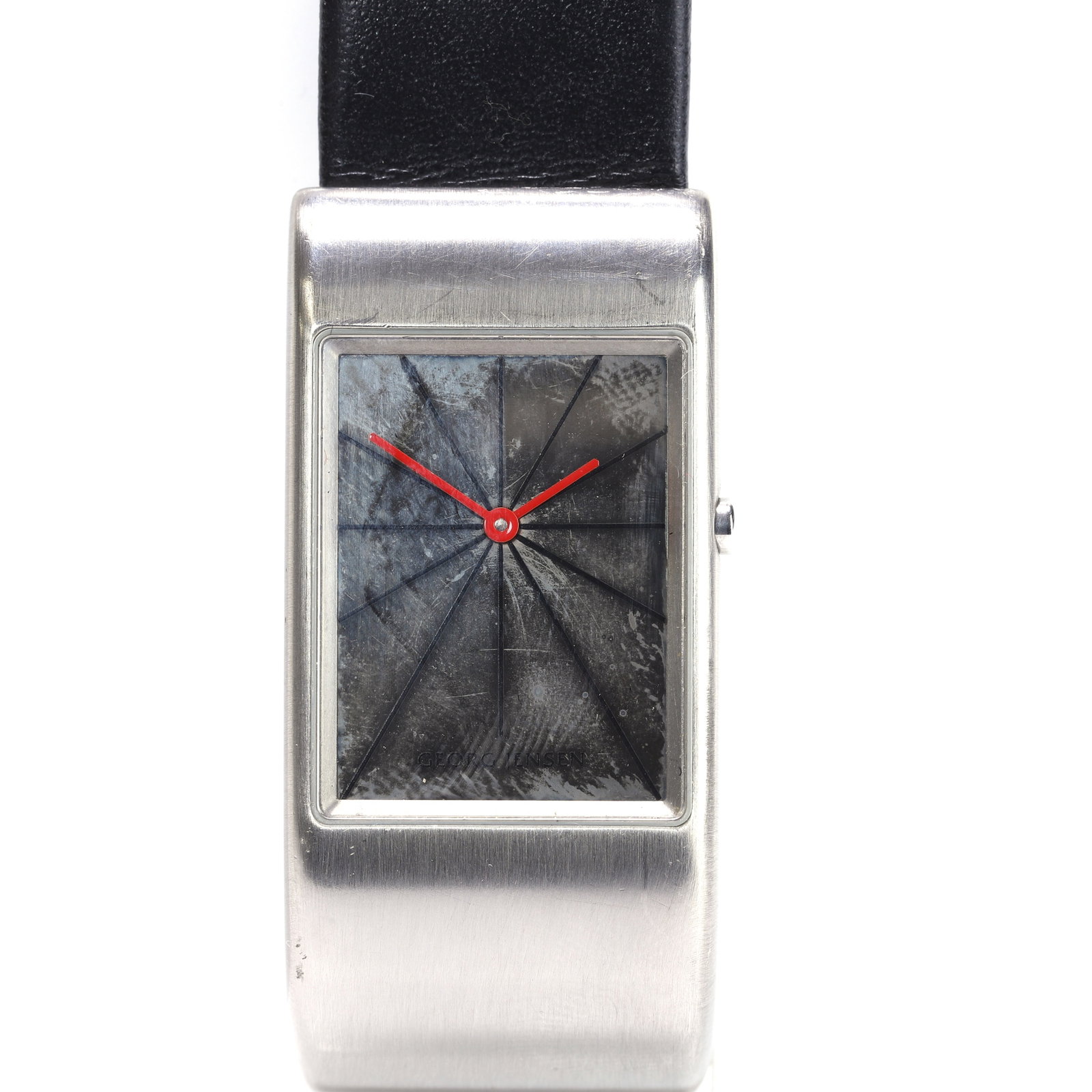 Georg Jensen, a stainless steel quartz strap watch,: Georg Jensen, a stainless steel quartz strap watch, model no. 378, designed by Nanna Ditzel for Georg Jensen, the brushed rectangular L-shaped case, with a signed mirror dial, radiating black hour mar