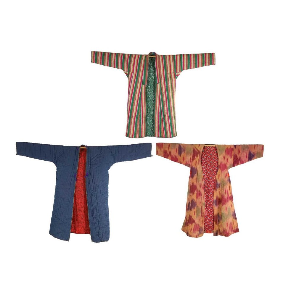 Three handmade vintage Uzbek coats: Three handmade vintage Uzbek coats quilted silk and cotton with printed patterns (123cm long from neck to hem and similar) (3) Condition Report: Overall the coats appear to be in mostly good order. Th