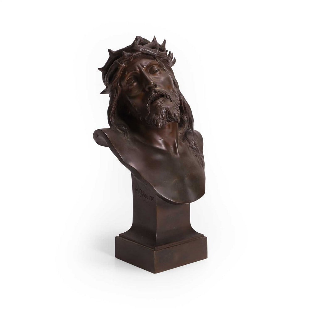 A bronze bust of Jesus Christ 20th century: A bronze bust of Jesus Christ 20th century shoulder length, with integral plinth, signed 'M. Béguine' (17cm wide, 11cm deep, 29cm high) Condition Report: Some wear and rubbing to the patinated fi