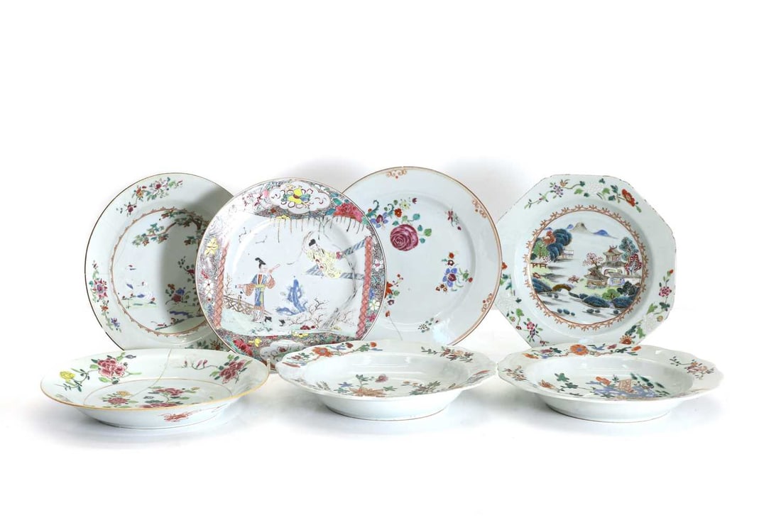 A collection of Chinese famille rose plates, 18th century,: A collection of Chinese famille rose plates, 18th century, each of circular form, comprising: three with a scalloped rim and painted with a landscape, an example painted with cranes beneath a tree,
