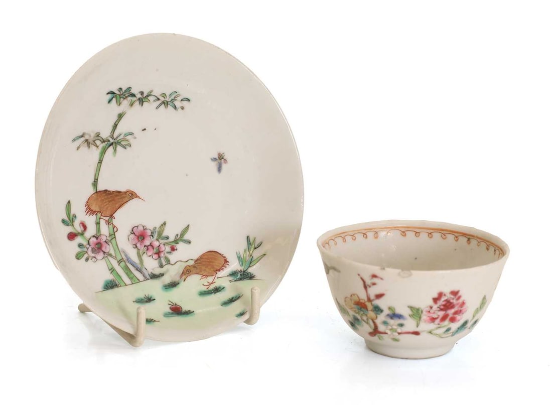 A Chinese export famille rose cup and saucer, 18th century,: A Chinese export famille rose cup and saucer, 18th century, painted with a quail perched on a bamboo branch and prunus, a further quail below, the teacup painted with flowering foliage 12cm diameter,