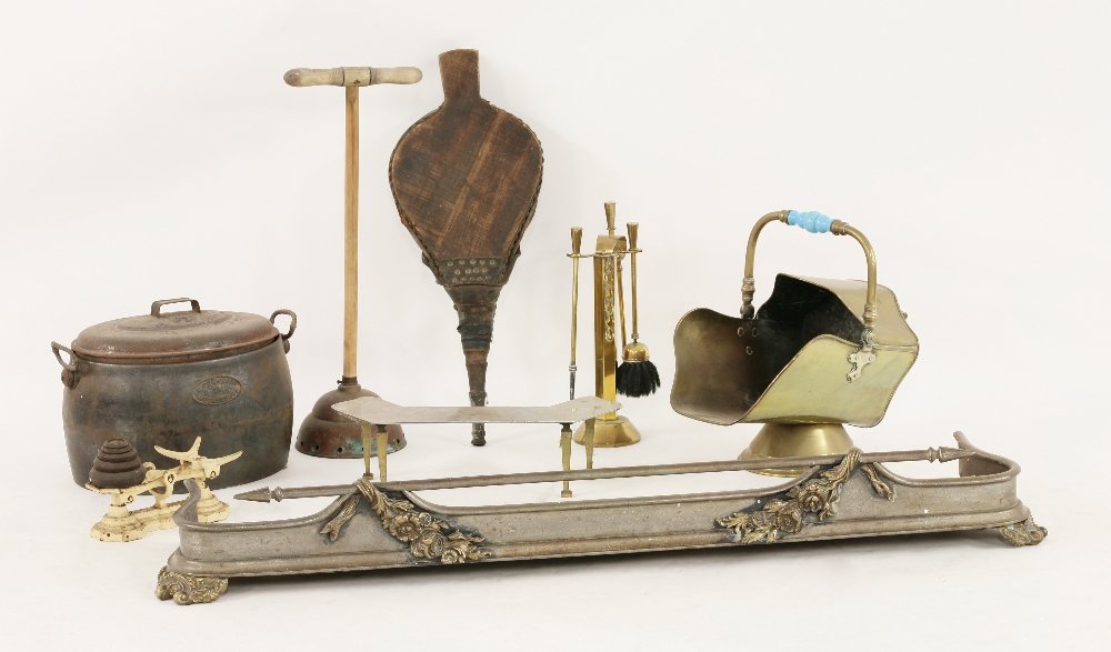 A Victorian iron and brass fender, with draped flower: A Victorian iron and brass fender, with draped flower and leaf branches, 138cm wide, and a brass fire scuttle, companion set, pair of bellows etc. (qty.)