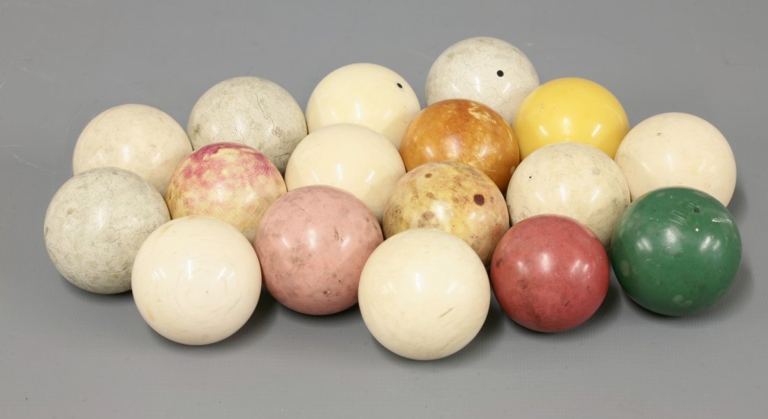 Ten stained ivory snooker balls, early 20th century,: Ten stained ivory snooker balls, early 20th century, together with seven further snooker balls, including three white clay balls (17)