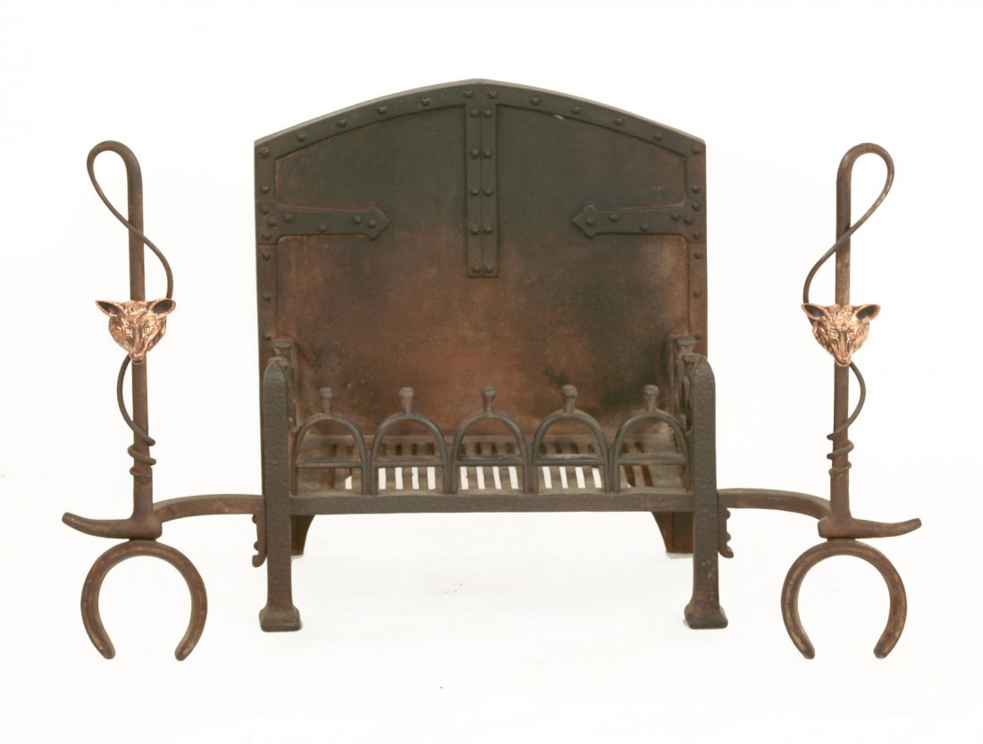 An unusual wrought iron fire basket, early 20th: An unusual wrought iron fire basket, early 20th century, the integral andirons in the form of riding crops with applied copper fox masks, 88cm wide 54.5cm high
