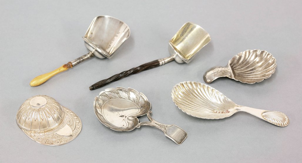 A collection of six silver caddy spoons, one by Joseph: A collection of six silver caddy spoons, one by Joseph Taylor, Birmingham 1812, with leaf shaped and engraved bowl and bifurcated fiddle pattern handle, 7.5cm long, a shovel caddy spoon with twisted w