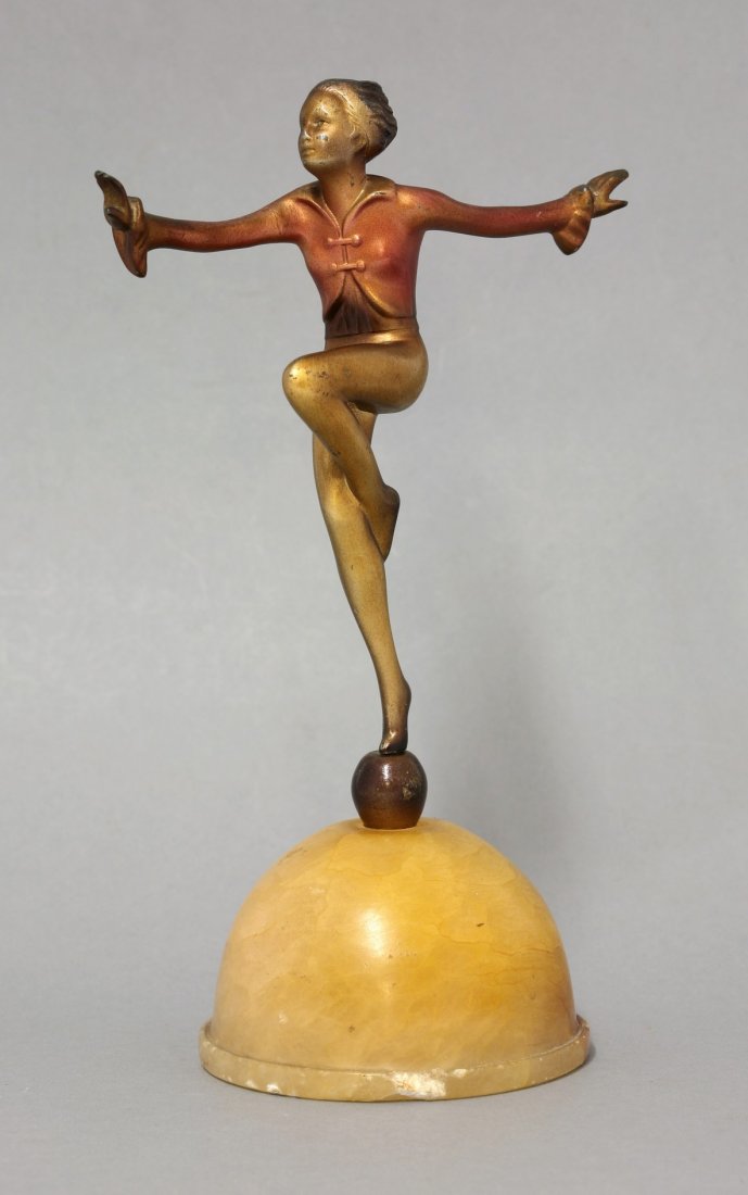 After Josef Lorenzl, a cold painted spelter dancer, on: After Josef Lorenzl, a cold painted spelter dancer, on a domed onyx plinth, 22.5cm