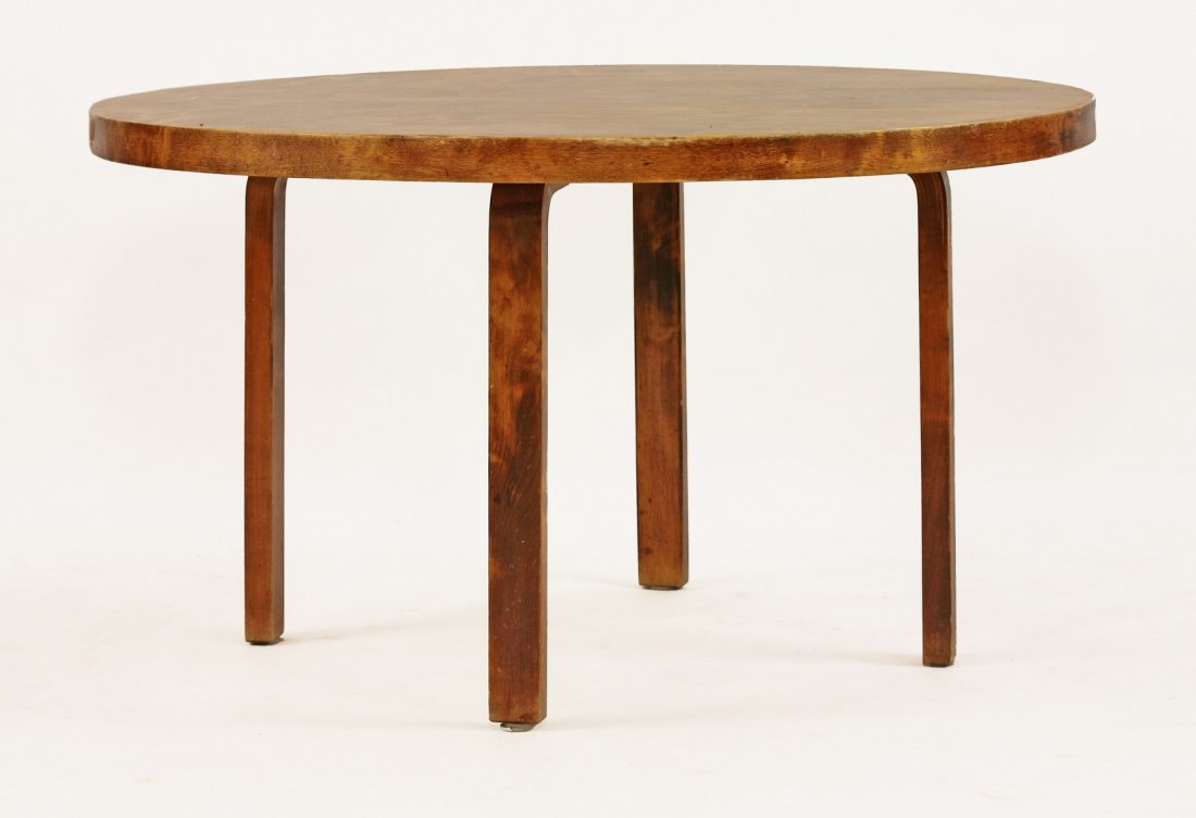A laminated circular dining table, by Alvar Aalto for: A laminated circular dining table, by Alvar Aalto for Finmar Ltd., labelled, 126.5cm