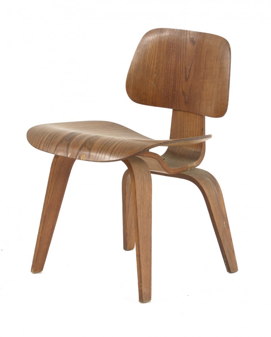 A moulded plywood DCW chair, designed by Charles and: A moulded plywood DCW chair, designed by Charles and Ray Eames, 73cm high
