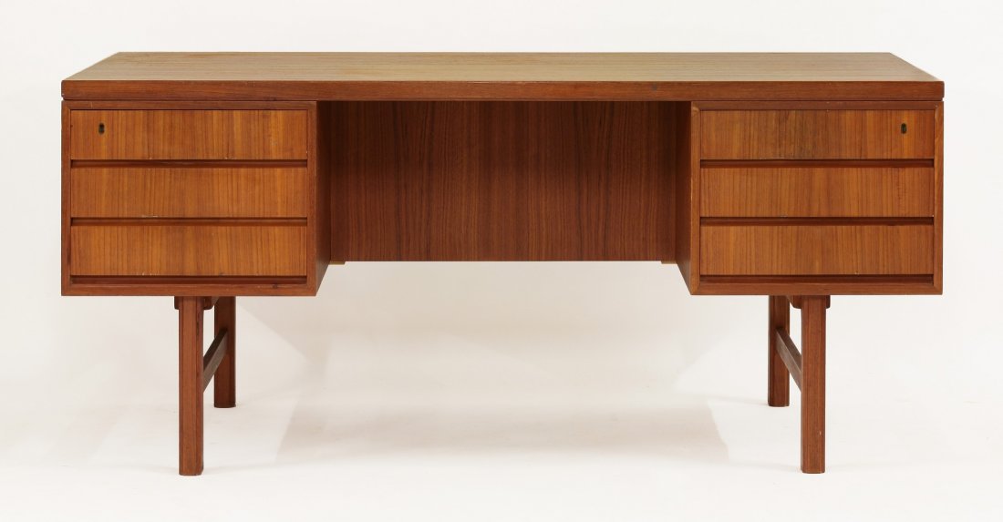 A Danish teak model 76 desk, by Omann Jun Møbelfabrik,: A Danish teak model 76 desk, by Omann Jun Møbelfabrik, with a plain rectangular top with three drawers each side, 156cm wide 79cm deep 71.5cm high