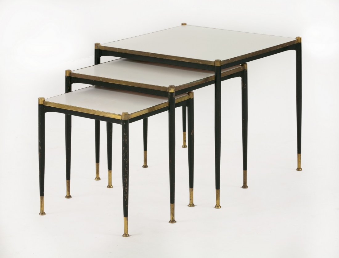 A nest of three square tables, 1950s, with Formica: A nest of three square tables, 1950s, with Formica tops, metal and brass tapering supports, 47cm wide 46cm high (3)