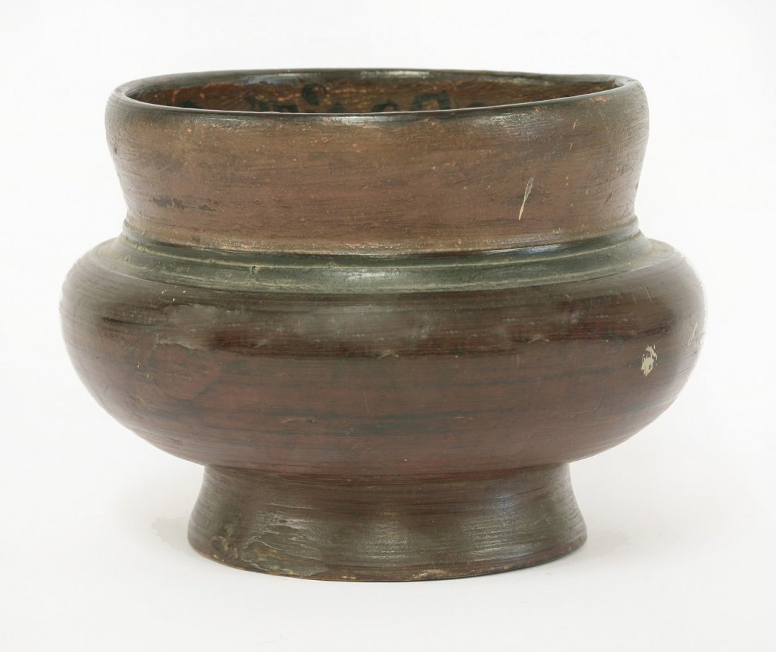 A Scandinavian turned softwood beer bowl, 1825, painted: A Scandinavian turned softwood beer bowl, 1825, painted all over and with a dated inscription to the inside rim, 19cm diameter