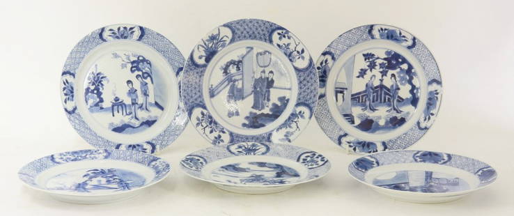 Six Kangxi blue and white Plates, 17th/18th century, a: Six Kangxi blue and white Plates, 17th/18th century, a pair with two ladies in a garden, the rim with panels of peaches and diaper, six character mark of Kangxi and of the period, one small chip, anot