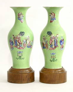 A pair of famille rose Vases, Jiaqing, each ovoid body: A pair of famille rose Vases, Jiaqing, each ovoid body painted with a bearded figure being fanned, Shou Lao and other immortals around on the sgraffito apple-green ground, both restored, 79cm, wood st