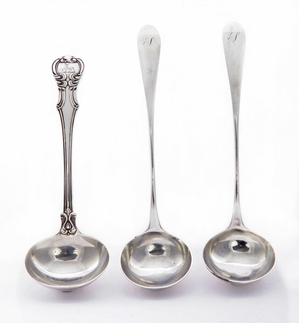 A pair of George III Scottish silver celtic point toddy: A pair of George III Scottish silver celtic point toddy ladles, by Andrew Spence, Edinburgh 1784 with incuse head, monogrammed, and a Victorian Victoria pattern silver sauce ladle, by Samuel Hayne & D