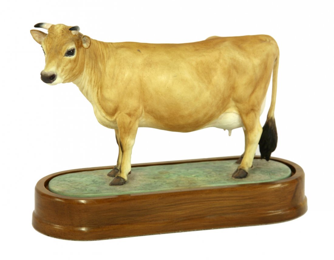 A Royal Worcester Jersey Cow, modelled by Doris: A Royal Worcester Jersey Cow, modelled by Doris Lindner, numbered 220/500, printed and painted marks, 17cm high, wood stand and certificate (2)