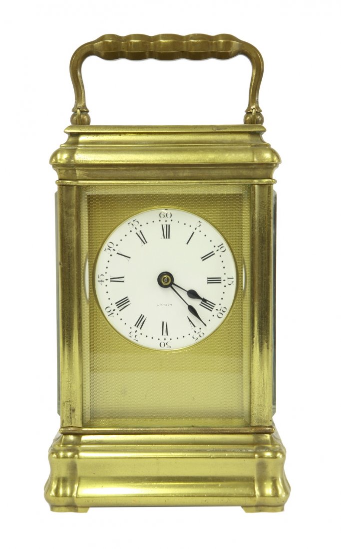 A giant brass carriage clock, 19th century, quarter: A giant brass carriage clock, 19th century, quarter striking on two gongs, the porcelain dial inscribed 'London', impressed 'B' in circle on back plate, in a gorge case, 25.5cm high to top of handle