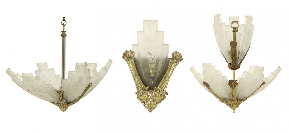A cast and bronzed ceiling light, with two tiers, each: A cast and bronzed ceiling light, with two tiers, each with arrow-shaped shades moulded with a flower girl, 50cm high, a matched ceiling light, 47cm high approximately, and a wall light, 35cm high (3)