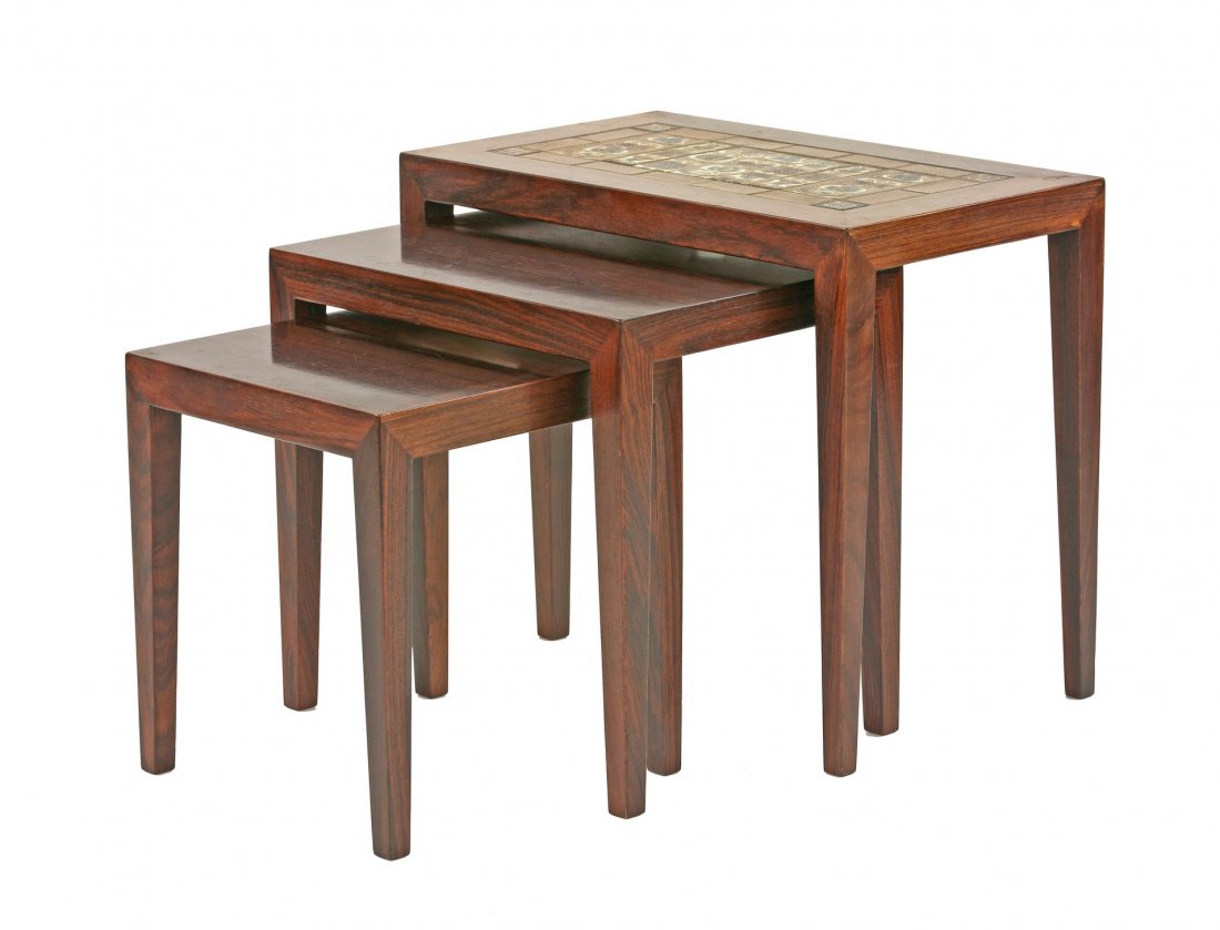 A nest of Danish rosewood coffee tables, 1960s, by: A nest of Danish rosewood coffee tables, 1960s, by Haslev, the larger table inset with Royal Copenhagen tiles, with Royal Copenhagen button and Danish Furniture Makers' Control labels, 59cm wide 35.5c