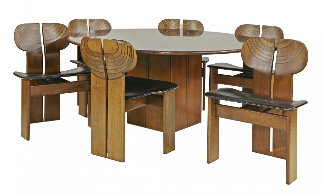 An 'Artona' dining suite, designed in 1975 for Maxalto: An 'Artona' dining suite, designed in 1975 for Maxalto by Afra and Tobia Scarpa, in walnut with ebonised details, comprising: a dining table, raised on a square plinth,with original cement ballast, la