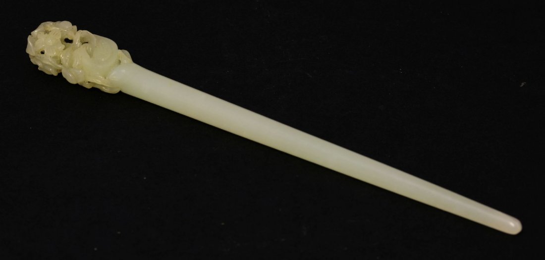 An unusual jade Zan, AFCpossibly Ming dynasty: An unusual jade Zan, AFCpossibly Ming dynasty (1368-1644), of typical fine tapering circular form, the knop pierced and engraved with a pheasant amongst lotus and peony, petal chip, 17.7cm