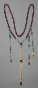 A string of beads, in various stones including ruby,: A string of beads, in various stones including ruby, kyanite, turquoise, mango jade and lapis lazuli, fitted lacquer box, 103cm