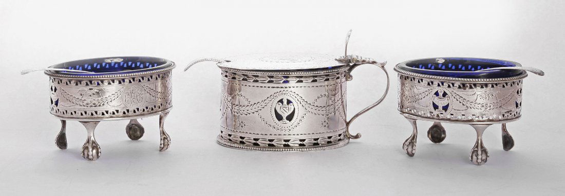 A pair of George III silver salts and salt spoons, by: A pair of George III silver salts and salt spoons, by Hester Bateman, the salts London 1784/5, the spoons 1786,the salts of oval form with bright cut engraved and pierced decoration, with beaded borde