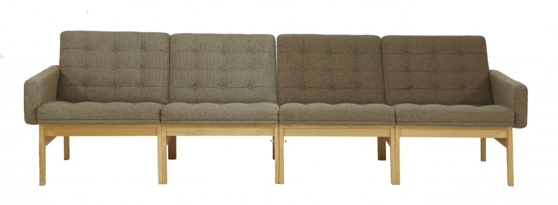 A 'Moduline' oak settee, in two parts, designed by Ole: A 'Moduline' oak settee, in two parts, designed by Ole Gjerlov-Knudsen, for Cado, with France and Son, gilt monogram, 250cm long (2)