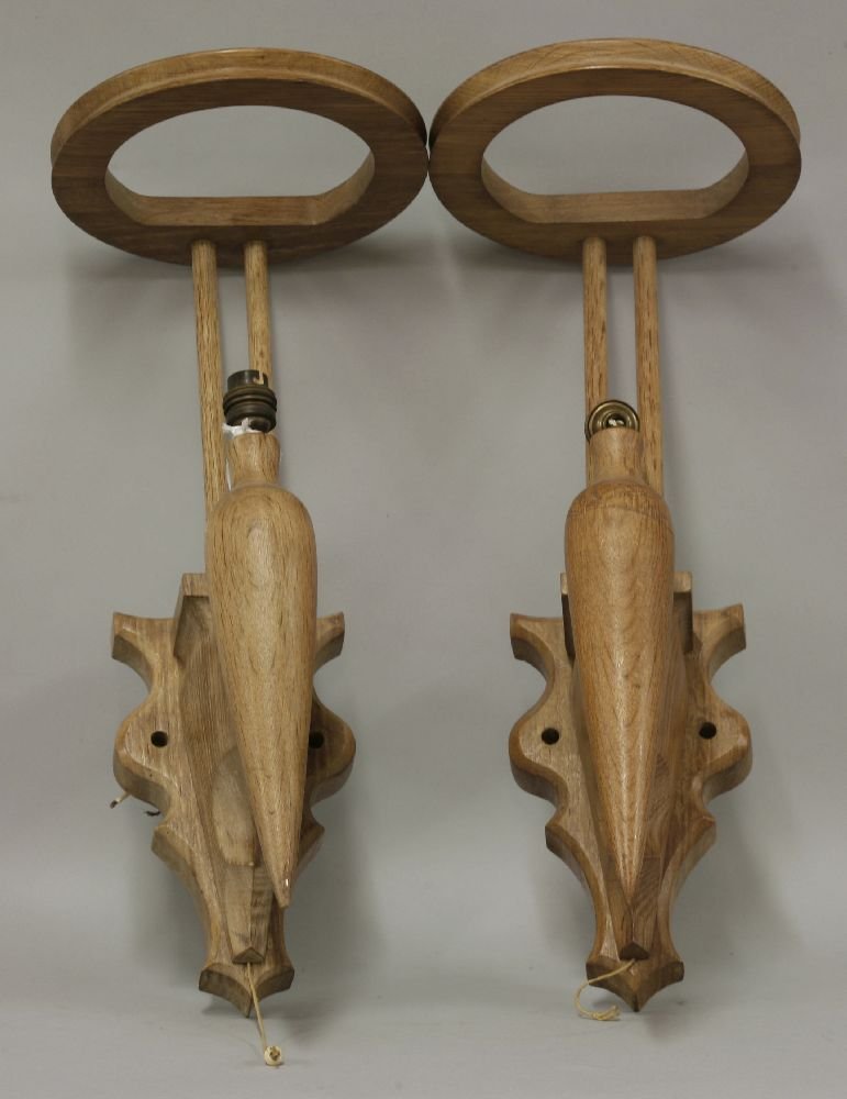 A pair of Modernist oak wall lights, by Jacques Blin,: A pair of Modernist oak wall lights, by Jacques Blin, 51cm high The modernist French designer, Jacques Blin (1920-1955), studied at the Br‚guet Aeronautical School in Paris and began making pottery