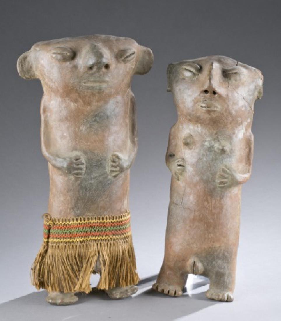 Pair of standing figures. CE 1000-1500.: Pair of Standing figures, Colombia, Middle Cauca, CE 1000 - 1500. Largest: 17 1/2"h. Smallest: 16"h.Provenance: The Alvin M. Cohen Collection, Bethesda MD.Condition: The absence of a condition stateme
