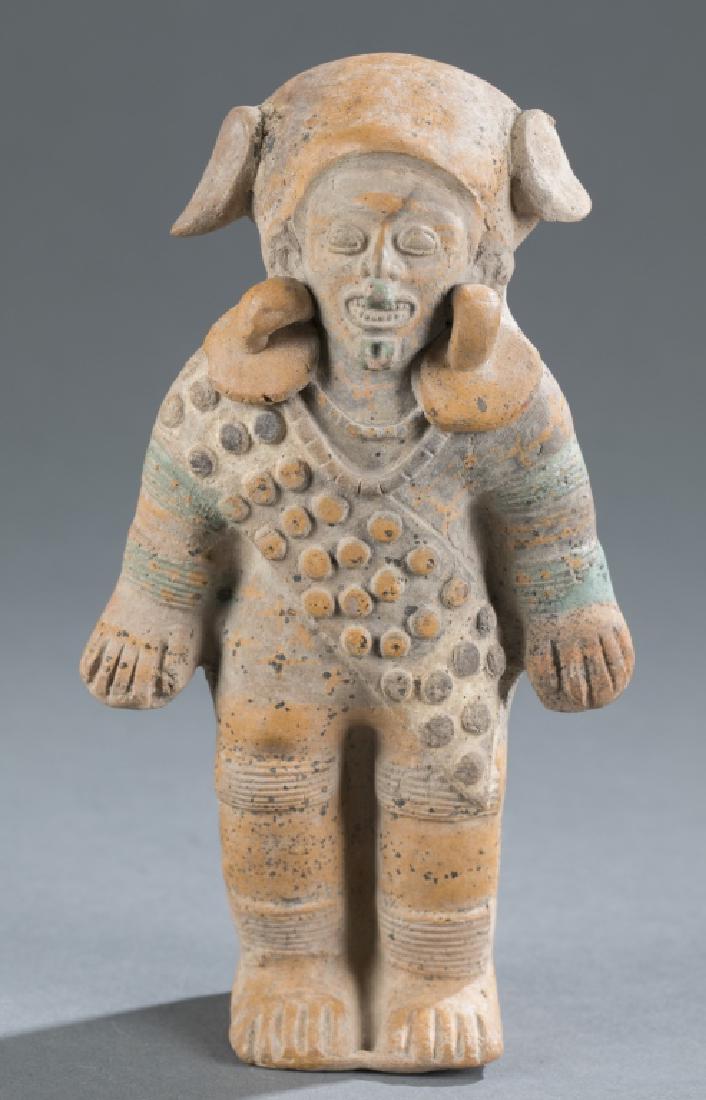 Standing figure with elaborate costume, Ecuador. (1 of 5)