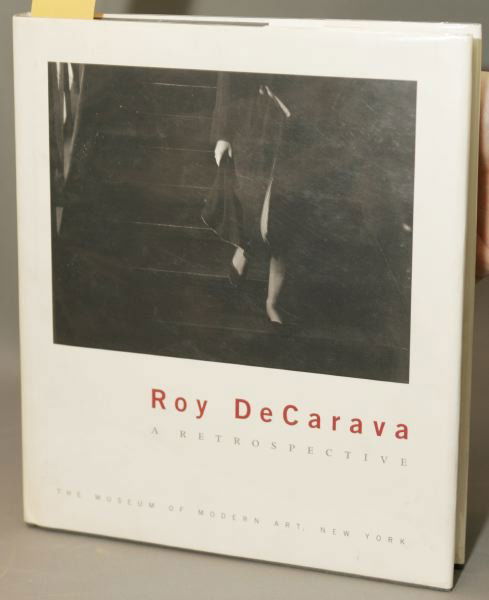 [PHOTOGRAPHY]. Peter Galassi. Roy DeCarava: [PHOTOGRAPHY]. Peter Galassi. Roy DeCarava: A Retrospective. NY: MOMA/Abrams, (1996). Grey cloth in dj. Gathering loose, else near fine. Signed and dated by the artist. This is a live auction at our p