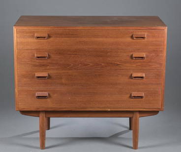 Povl Dinesen mid-century modern 4 drawer dresser.: A Povl Dinesen mid-century modern dresser with four drawers, incised hand pulls, and tapered legs. 2nd half 20th century. 35"h x 39 1/4"w x 18"d. Condition: Scuffs, scratches and abrasions consistent