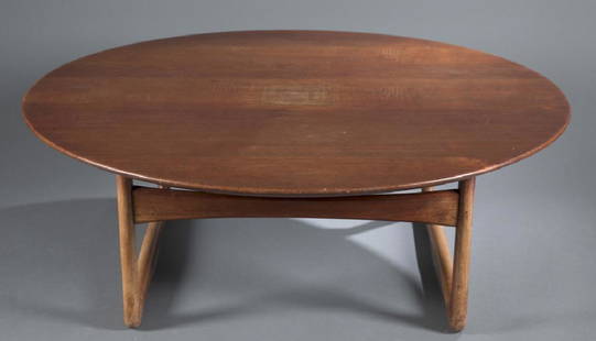 Danish mid-century modern teak coffee table.: A teak Danish mid-century modern round coffee table by Povl Dinesen. 15"h x 42"diam. Condition: Scuffs, scratches and abrasions consistent with age.