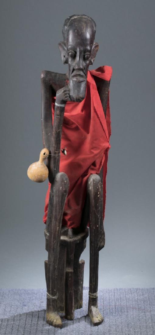 Seated African figure. 20th century. (1 of 4)