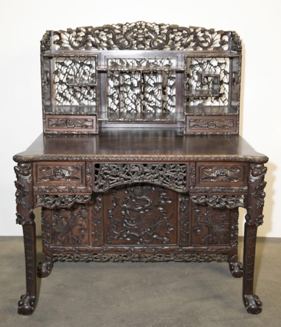 A carved hardwood writing desk.