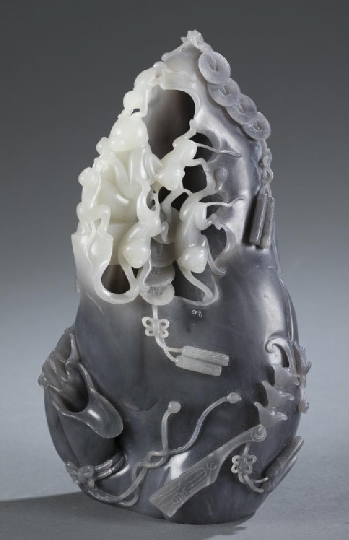 A Chinese carved ink and white jade carving. (1 of 5)