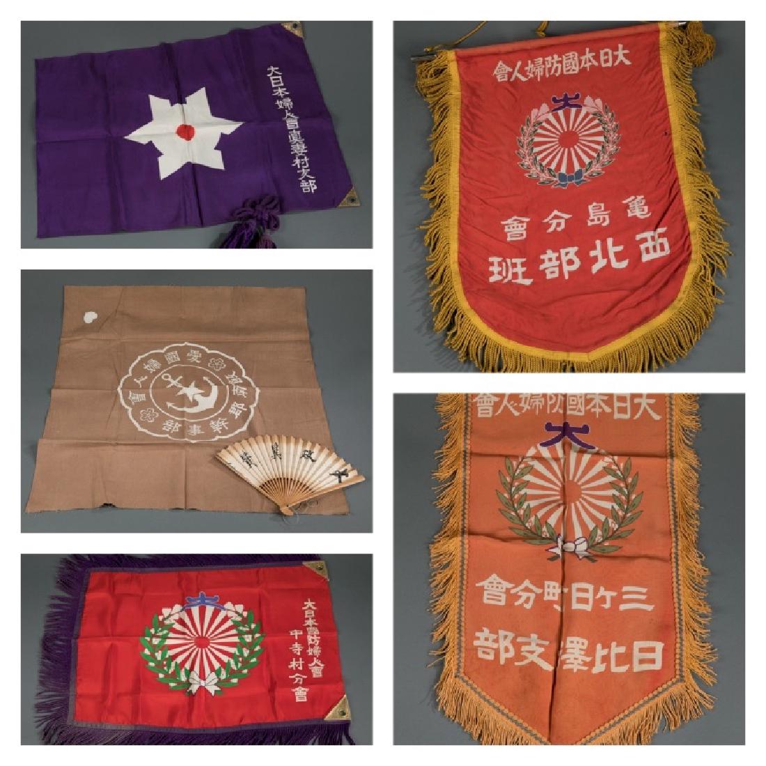 5 Japanese women's patriotic association banners: A group of five Japanese women's patriotic association--Dai Nippon Fujin Kai flags and banners. ++ A Women's patriotic association flag from Kameshima. ++ A Women's patriotic association from Hibisawa
