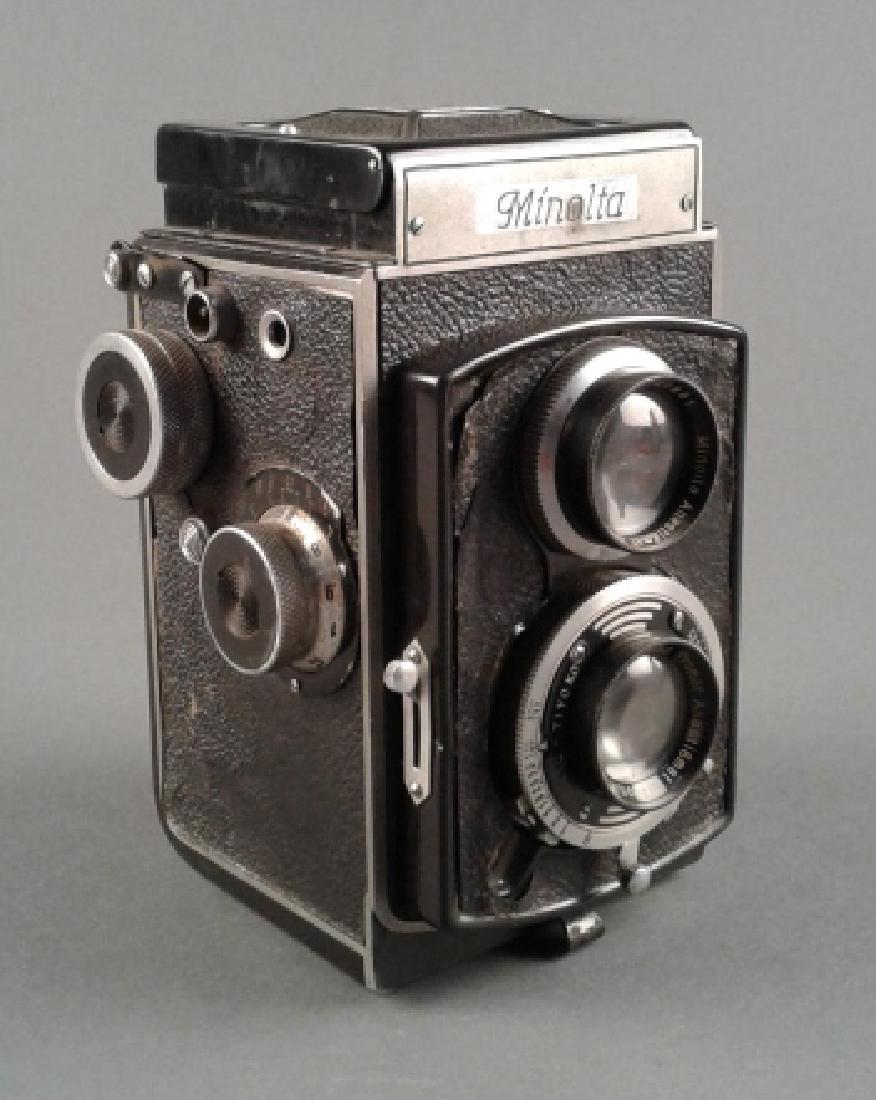 Minolta Autocord & Minoltaflex Cameras: Minolta Autocord & Minoltaflex Cameras - Autocord; Serial 460697. Top view camera with over under rokkor lenses and Minoltaflex. 1936. Crown II-Tiyoko. With Promar Anastigmat Nippon 1:3.5 f-75mm lens 