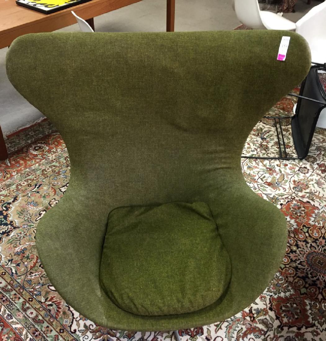 Arne Jacobsen Mid-century of Egg chair in green: Arne Jacobsen Mid-century Egg chair in green upholstery.Original Fritz Hansen maker sticker on base.