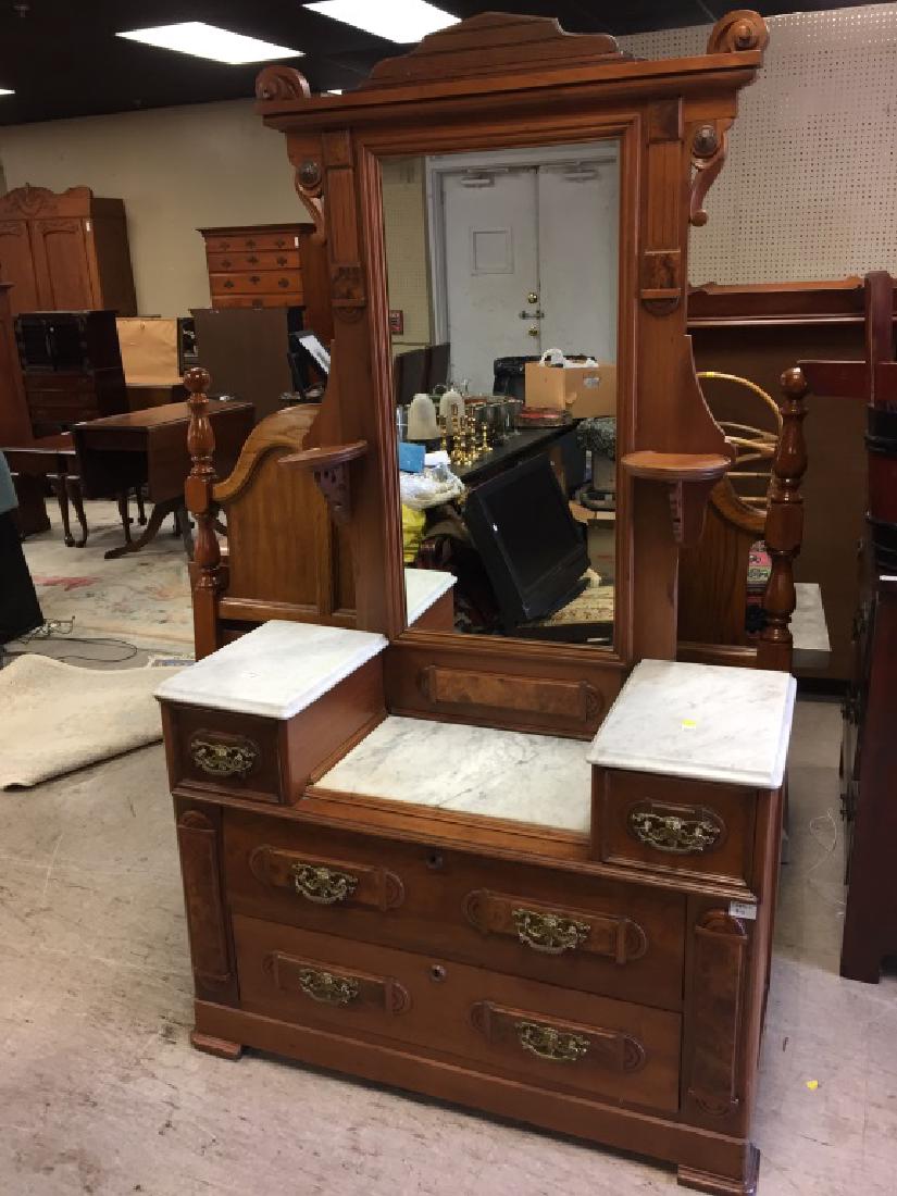 Eastlake style marble topped vanity: Eastlake style marble topped vanity having ornate drop pulls on two glove boxes over two drawers
