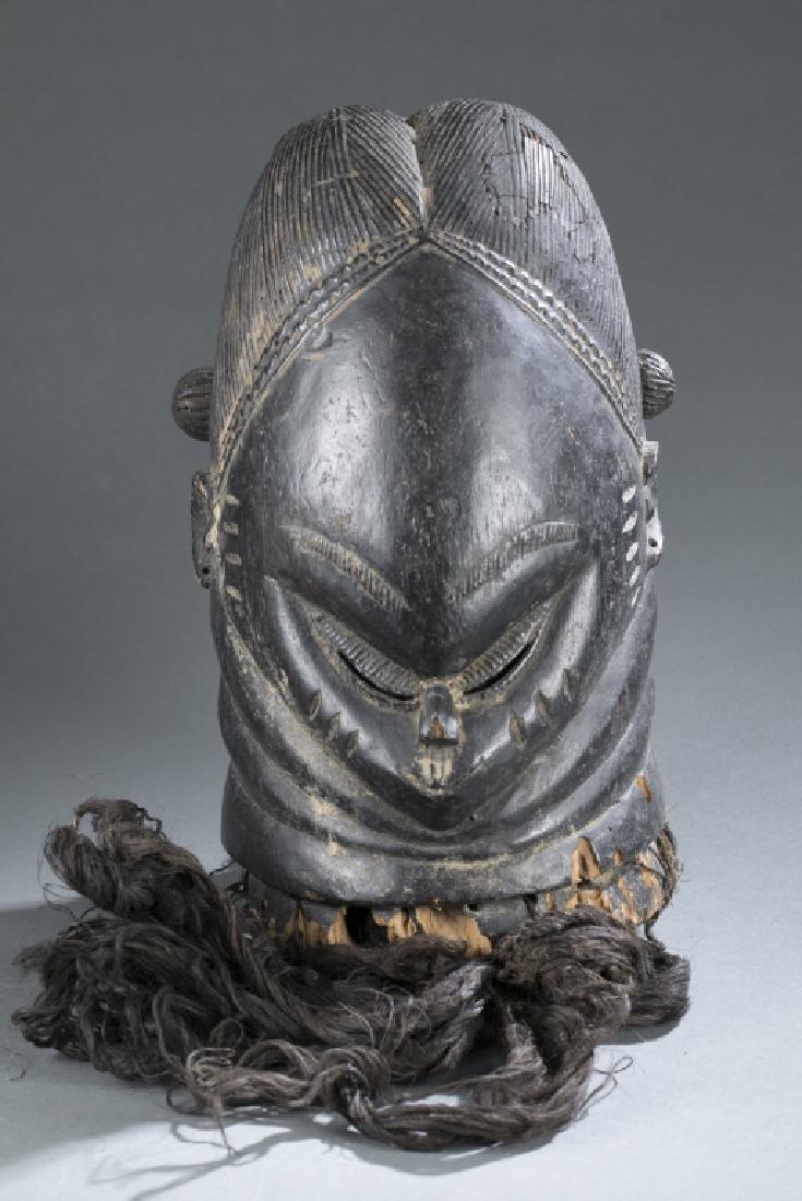 Bundu society helmet mask. c.20th century.: A Bundu society helmet mask. Sierra Leone, Mende. c.20th century. Inventory and Collection from the Estate of Merton D. Simpson.