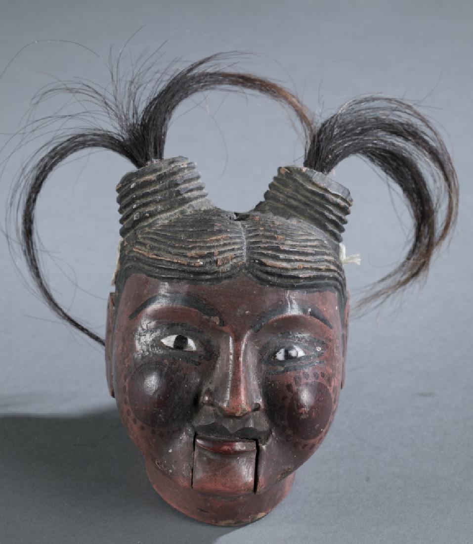 A Myanmar traditional wooden female puppet head. (1 of 7)