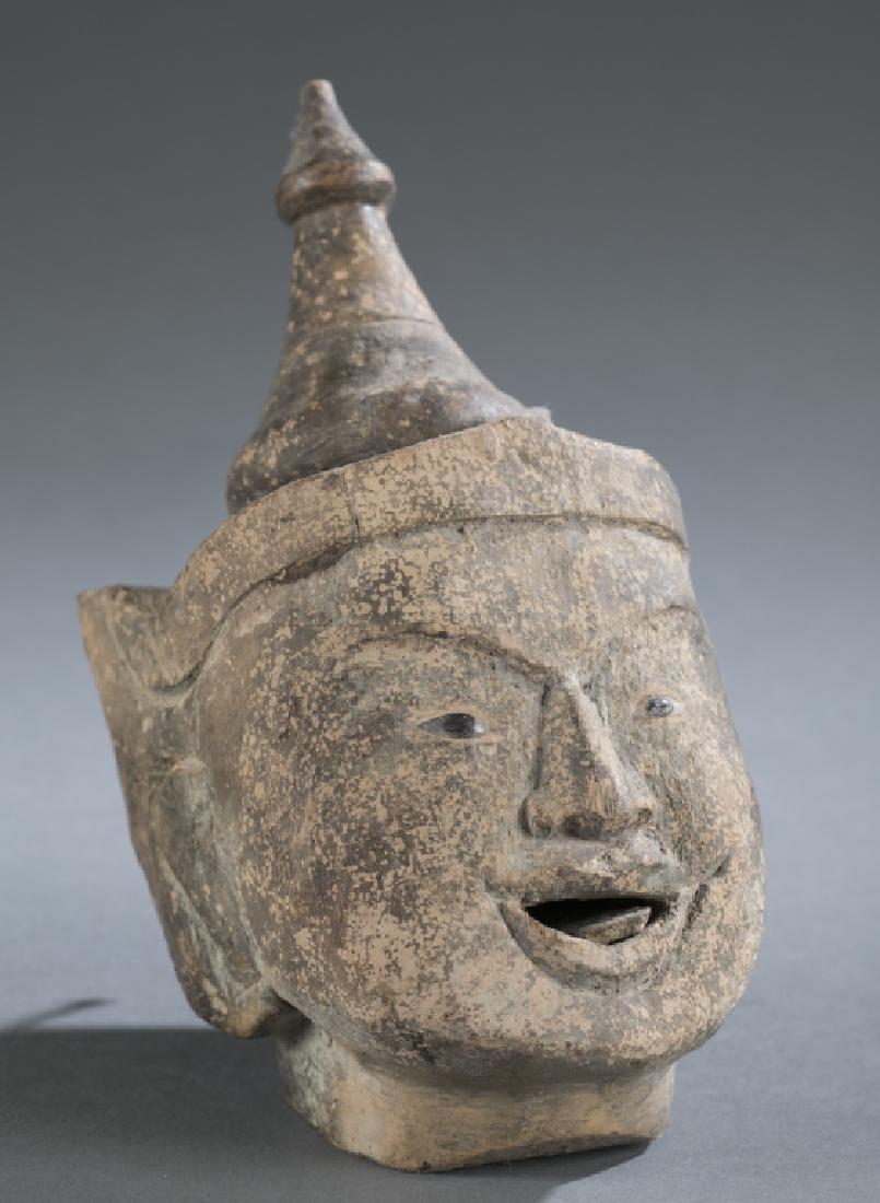 A Myanmar traditional wooden male puppet head.: A Myanmar traditional wooden male puppet with a movable tongue. 9" x 4 1/4".