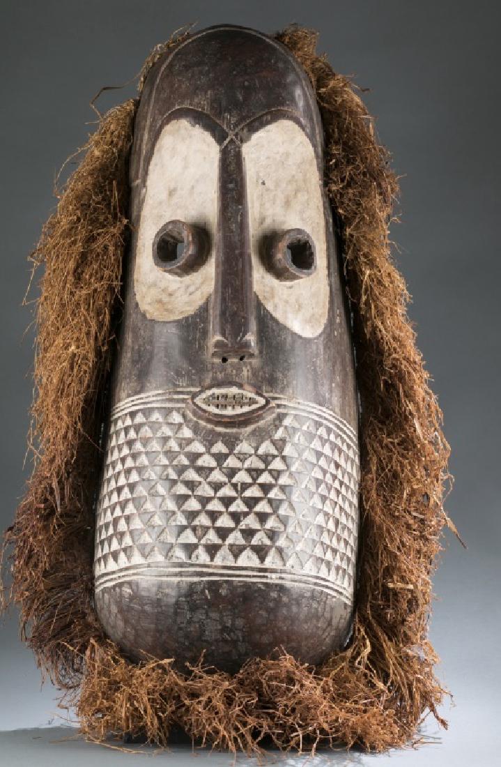 Congo style mask with raffia. C.20th. (1 of 7)