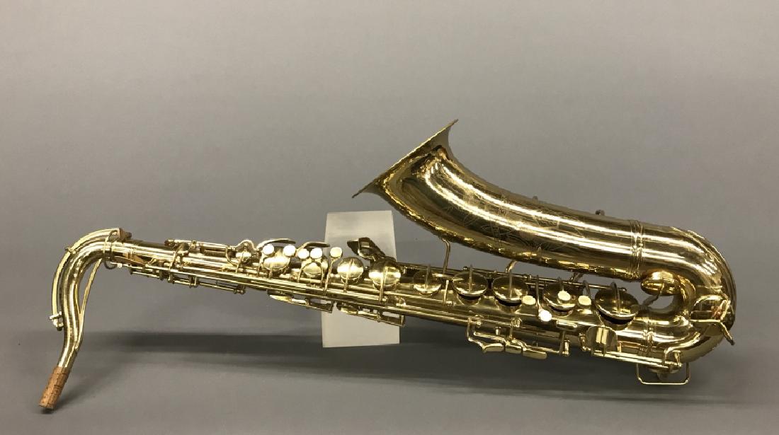 C.G Conn LDT make Naked lady saxophone.: A C.G Conn LDT make Naked lady saxophone with case. 30" x 6"diam.
